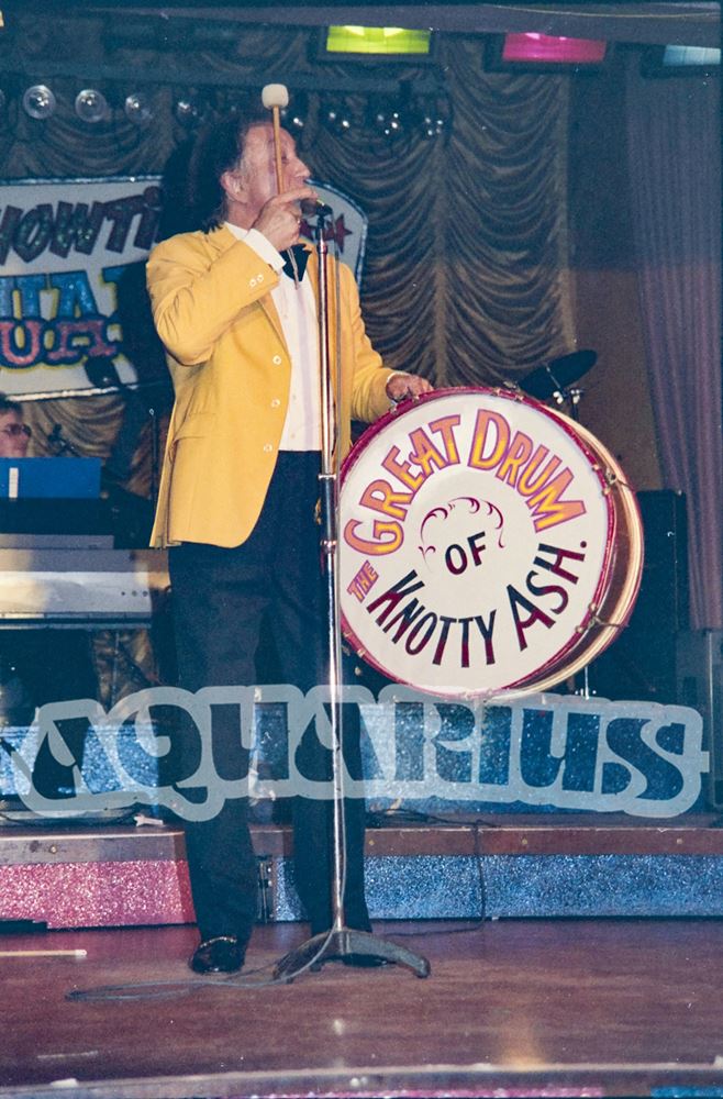 Ken Dodd on stage with the great drum of Knotty Ash