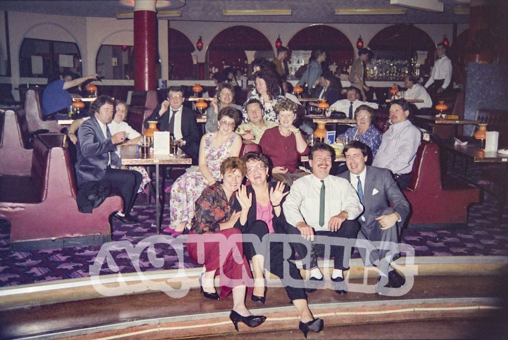 Customers posing for the photograph in the cabaret club