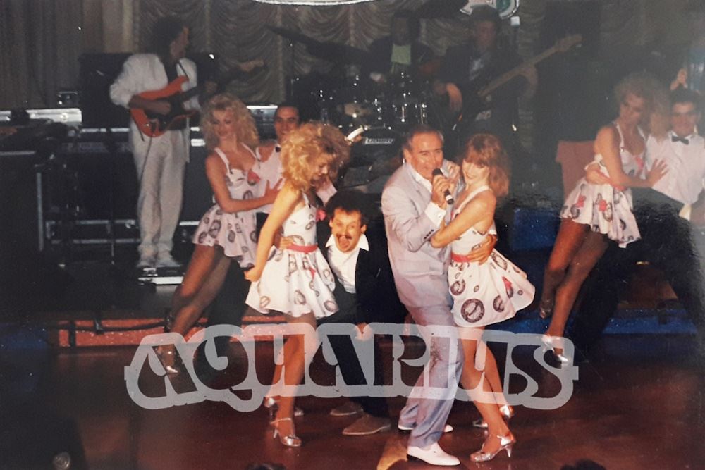 Cannon and Ball on stage with dancers and band