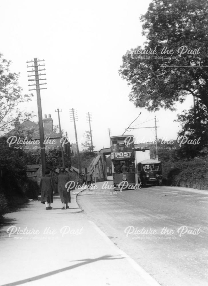 A tram and Williamson's bus passing each other, Nottingham Road, Ripley, c 1920-1940s