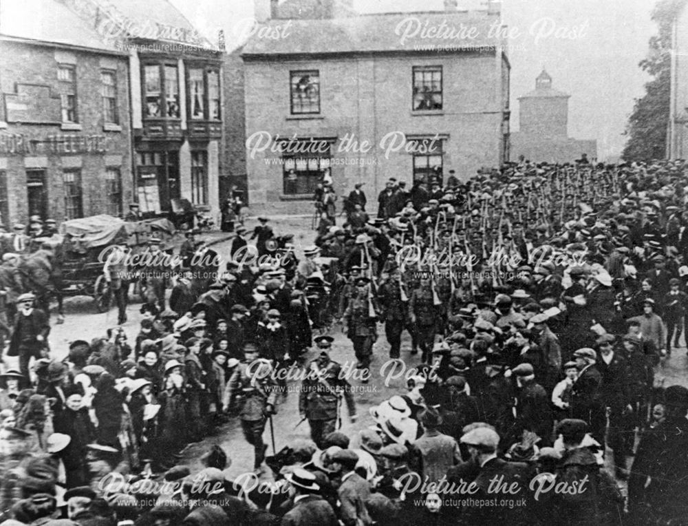 Soldiers marching across Ripley Market Place