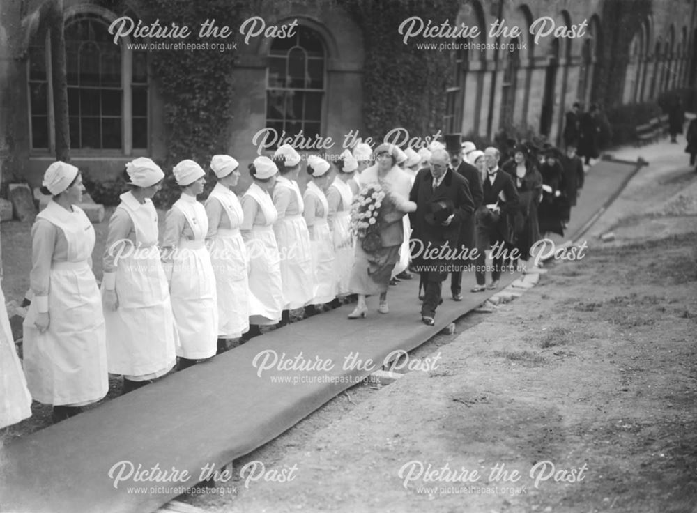 Princess Mary walking on duckboards past nurses at The Devonshire Royal Hospital