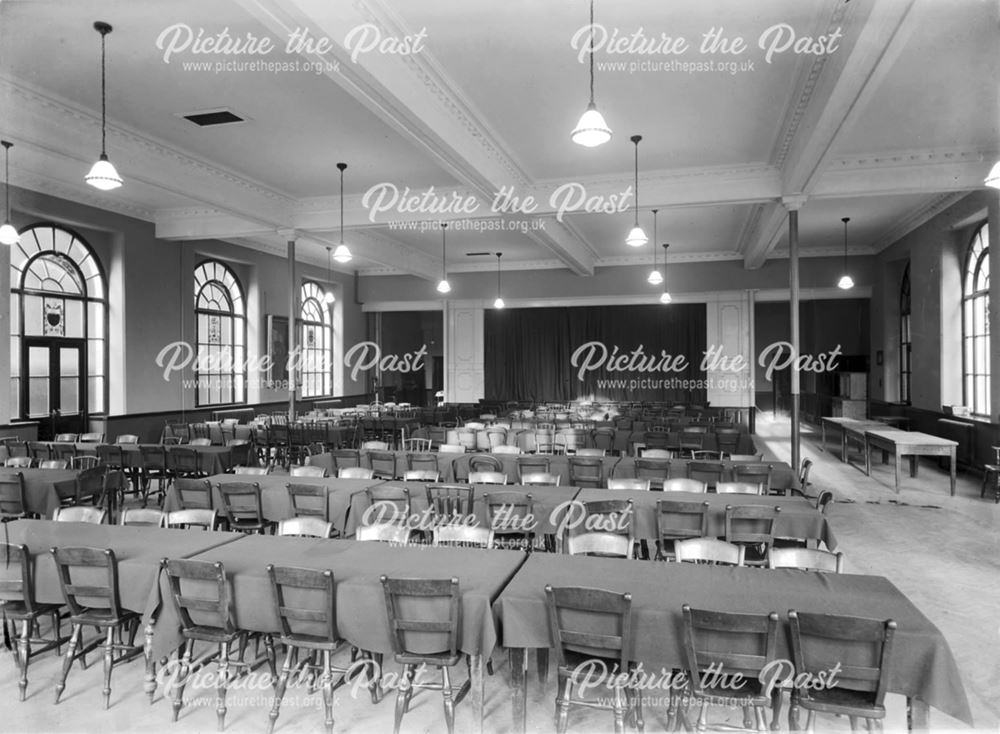 Entertainment theatre set out with tables - The Devonshire Royal Hospital