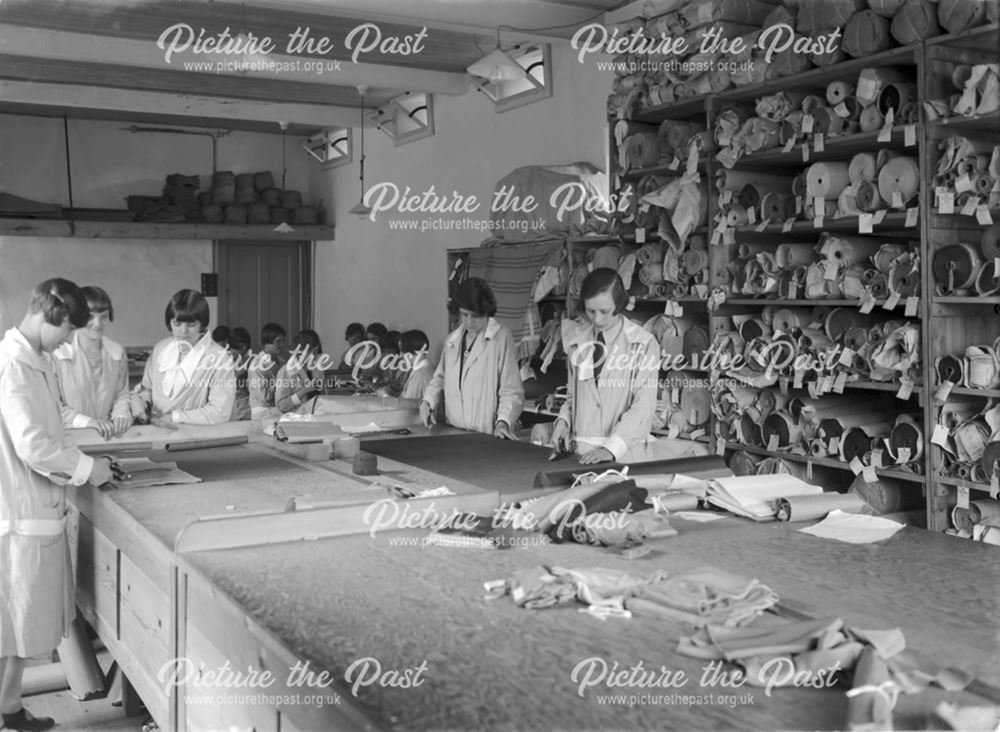 Cloth cutting at Baker and Sons, clothing factory