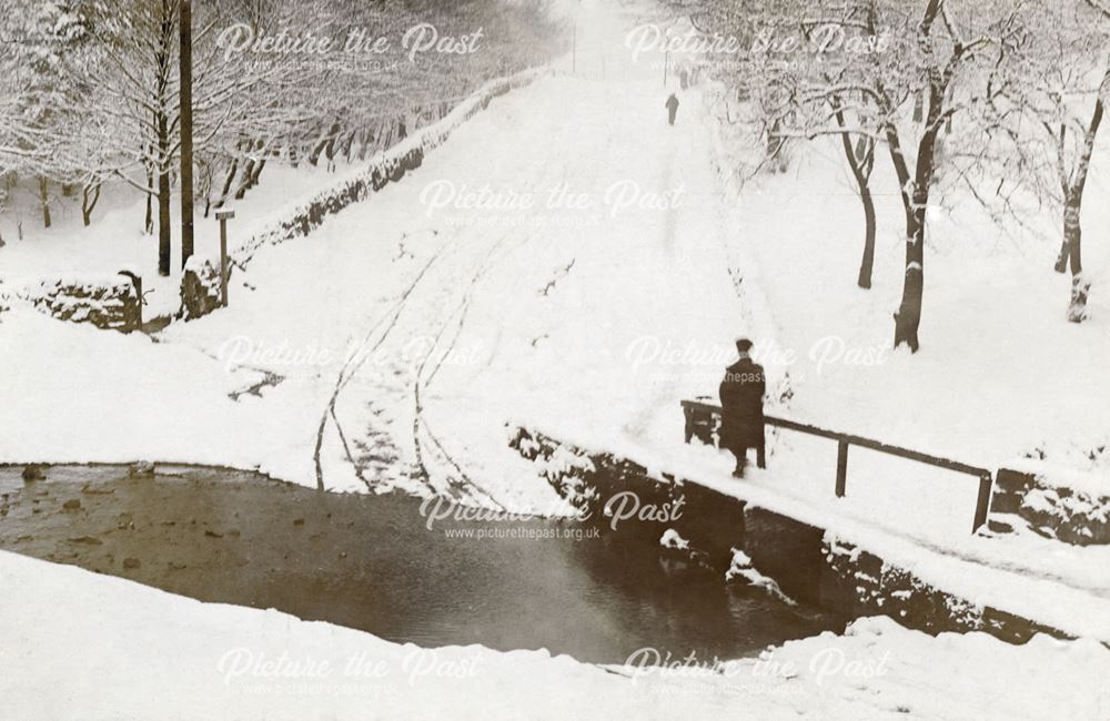 Ford on Brown Edge Road in the snow, Buxton, pre 1948