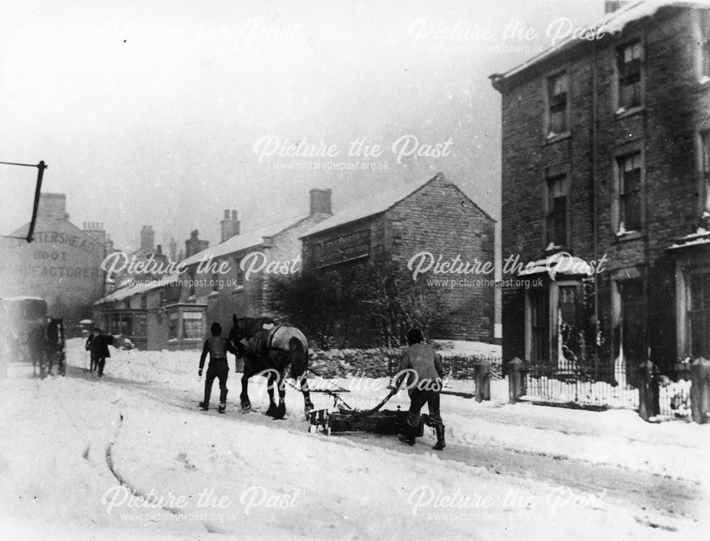 High street in the snow horse and carriage Buxton