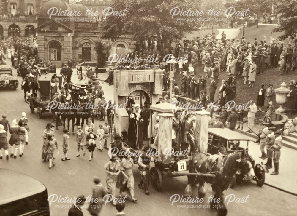 Crowds watch the carnival parade in the Crescent