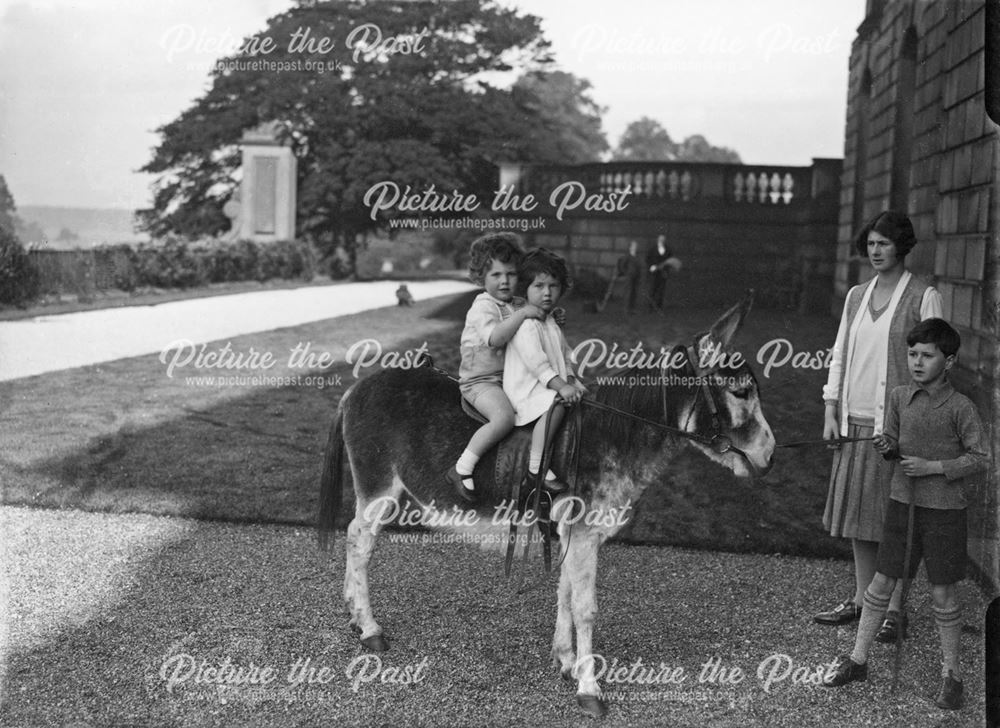 Andrew Cavendish holding the donkey for his cousins at Chatsworth House, 1927