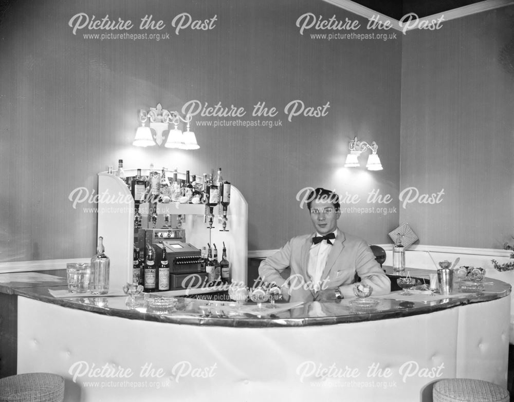 Barman behind new bar at the Palace Hotel, Palace Road, Buxton, c 1960