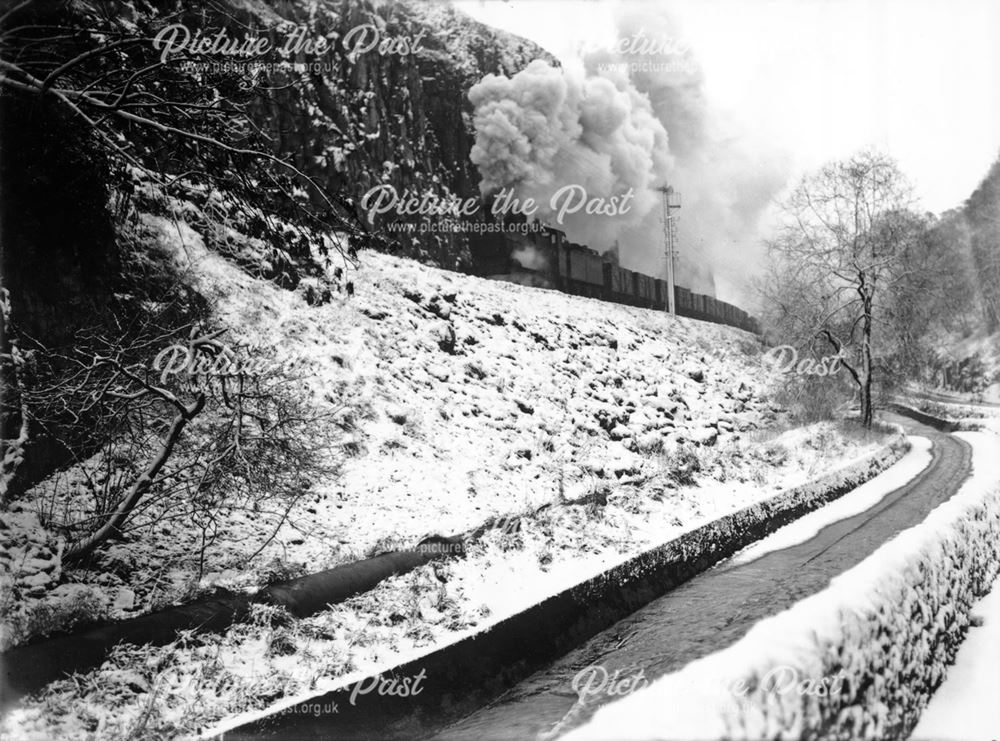 Goods train in snow on Midland Railway line, Ashwood Dale, Buxton                                   