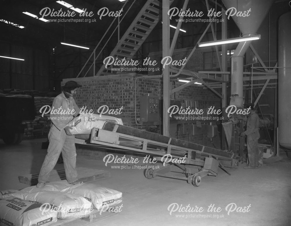 Operative palletising bags from bagging machine, Lime-Sand Mortar Ltd, Buxton, 1967                 