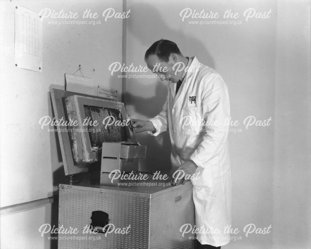 Man at milk testing machine, The Milk Marketing Board, Fairfield, Buxton, 1957                      