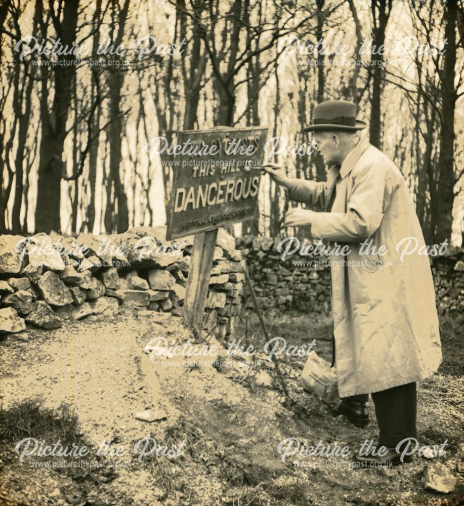 Painting a warning sign, unknown location, c 1930s