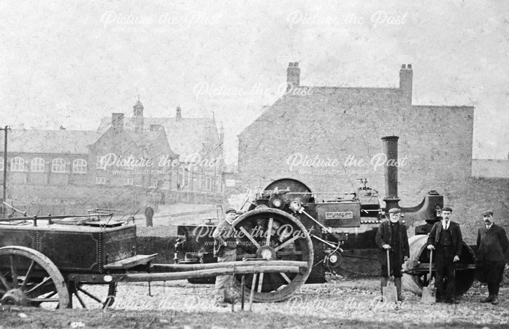 A group of Workmen with a traction engine