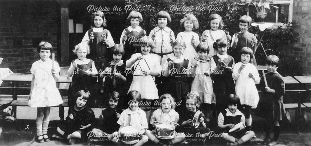 Shirebrook Model Village school class of girls with musical instruments