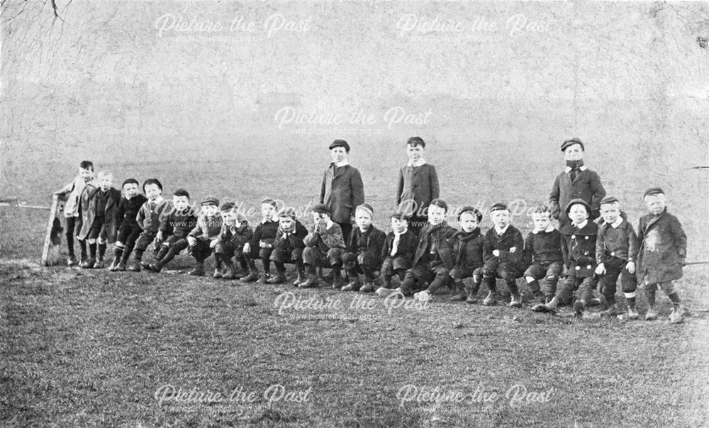 A Group of boys lined up in a field