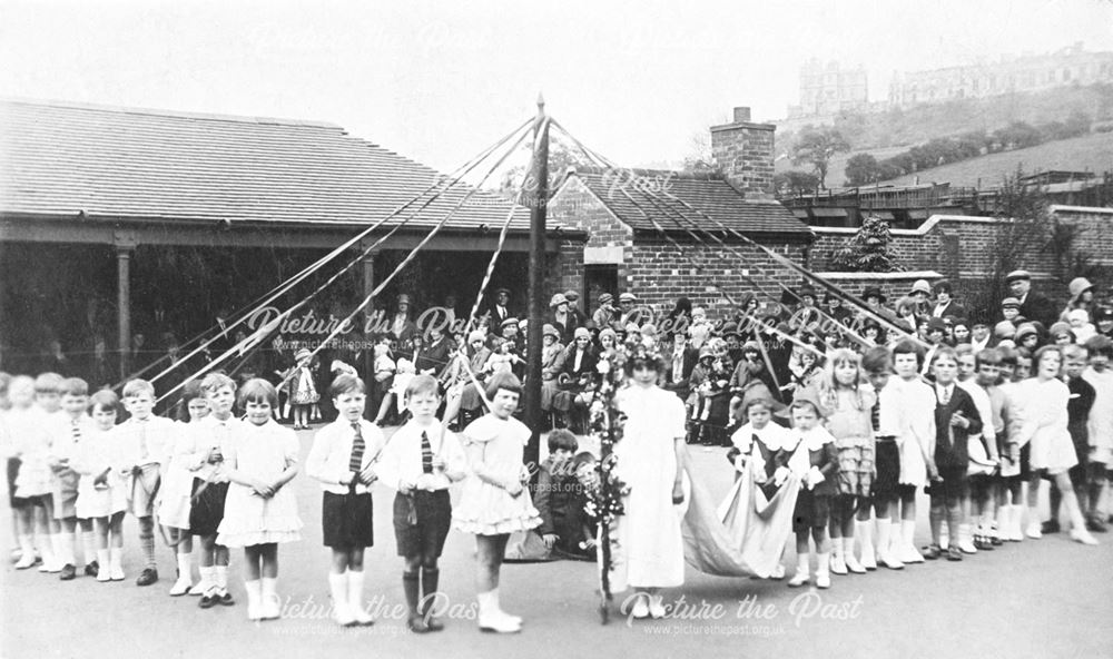 Maypole dancing at the Model Village School