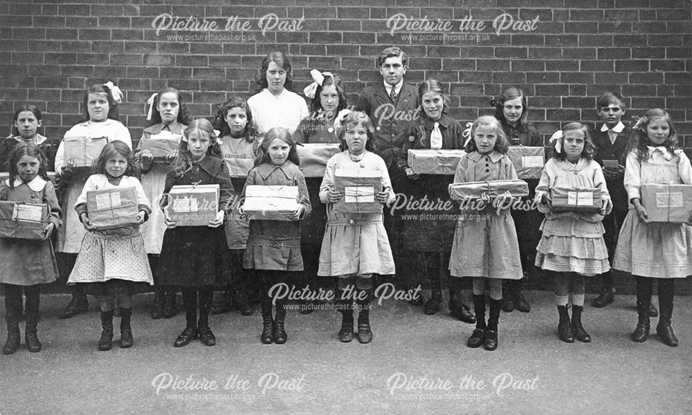 School children holding parcels for P.O.W.'s