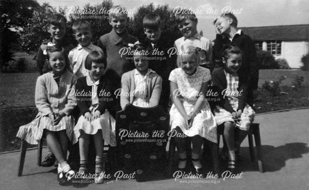 Happy children posed with a shield, Shirebrook