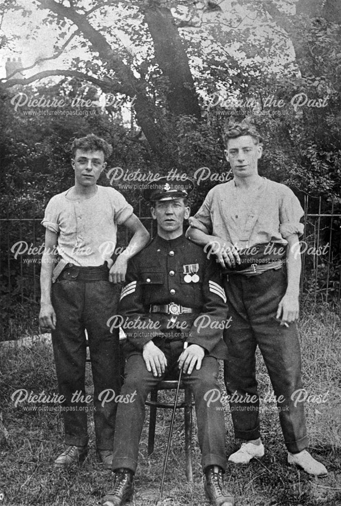 Tommy Thomas in Royal Marine uniform with two young men, Bolsover, post 1918 ?