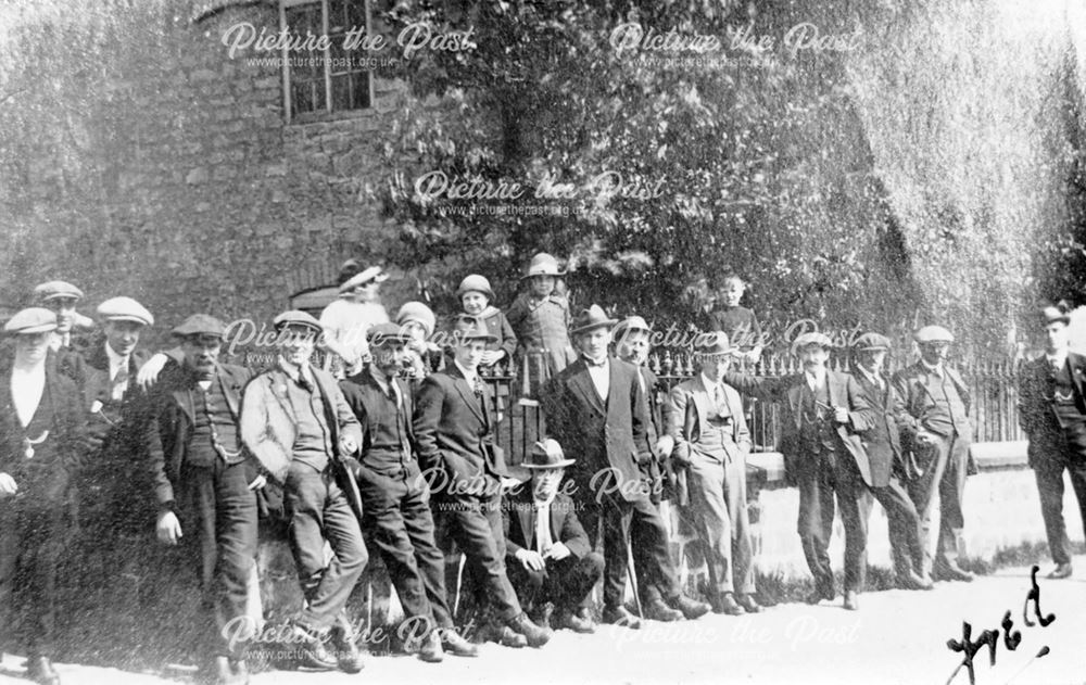 Group of men outside Pear Tree Cottage, Whitwell