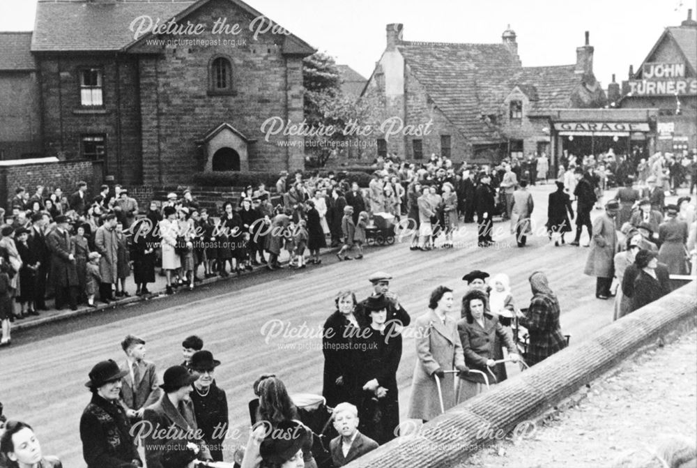 Crowds gathered on Church Street to watch the parade, Staveley