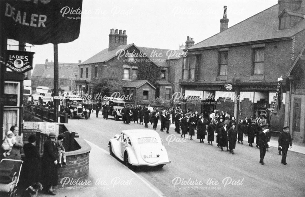 Salvation Army at the head of a Funeral Procession, passing Hodson's Cafe