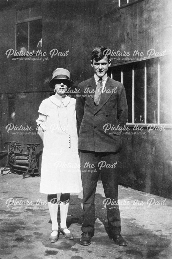 Cecil G Adams and girl, outside Boldry's Shop, Lowgates