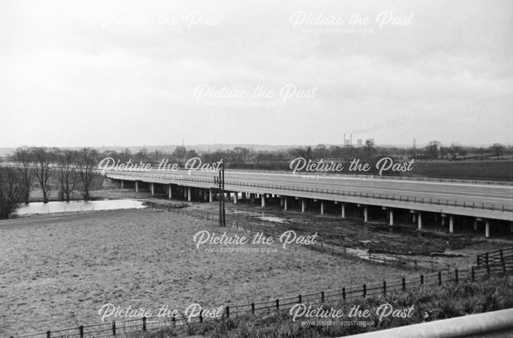 The newly constructed M1 Motorway crossing over floodwater near the River Trent