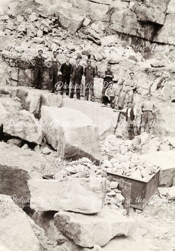 Workmen posed against the Quarry Face at The Dene Quarries