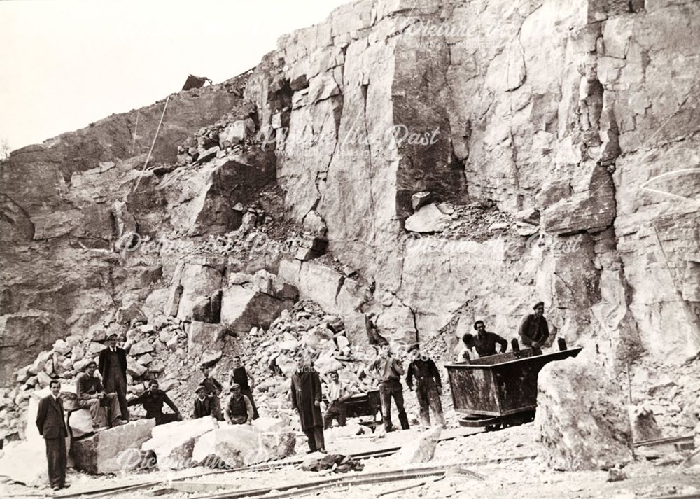 Workmen posed against the Quarry Face at The Dene Quarries