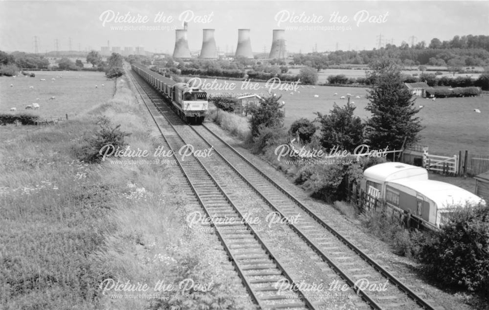 An unidentified Class 58 heads a 'down' coal train west through Birds Fields, Weston on Trent