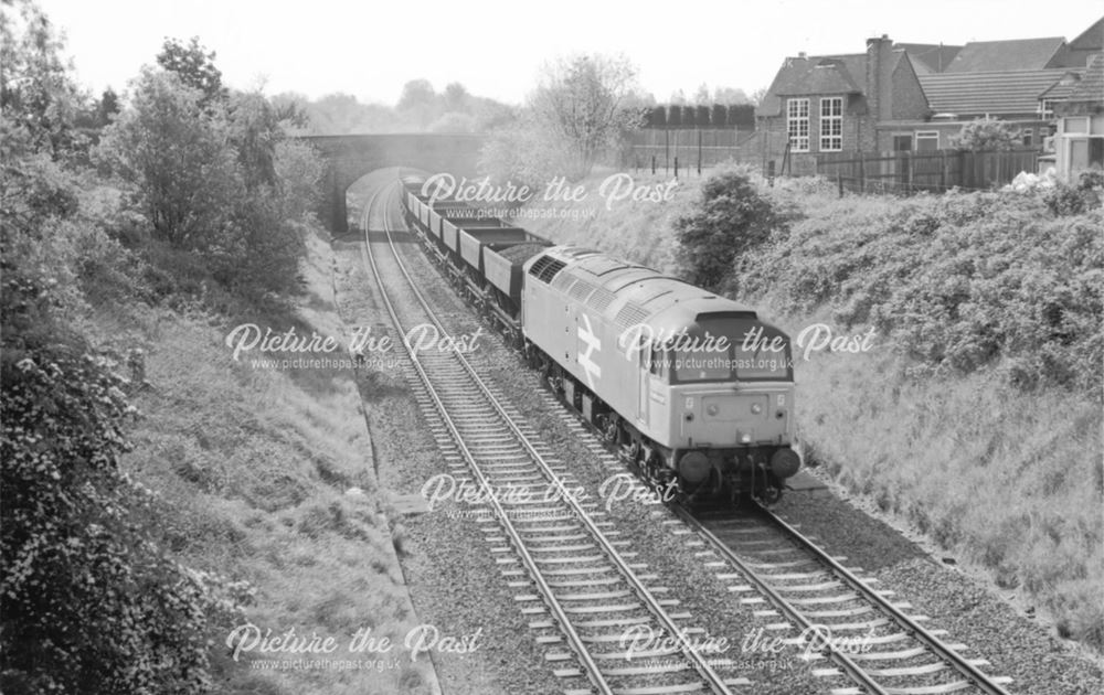 A coal train passes Weston on Trent School