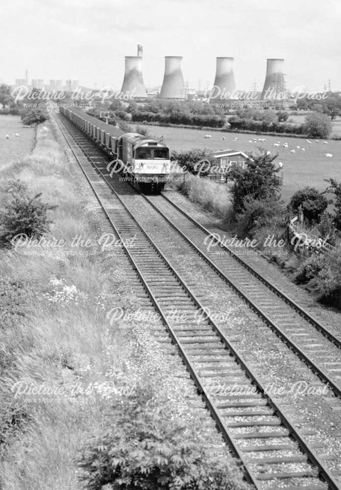 An unidentified Class 58 heads a 'down' coal train west through Birds Fields, Weston on Trent