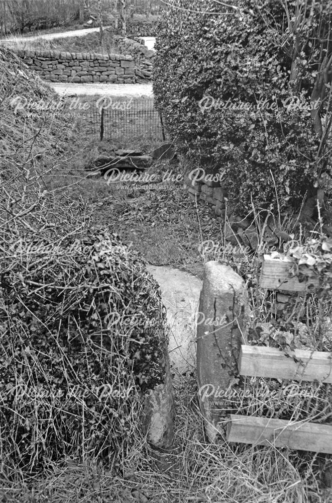 Stile slab bridge and well by Brook Cottage