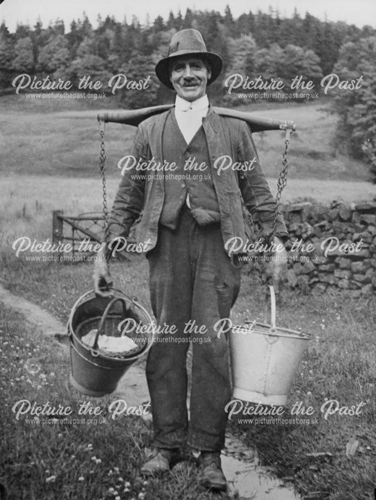 Man wearing yoke, Castle Top Farm, Cromford, 1936