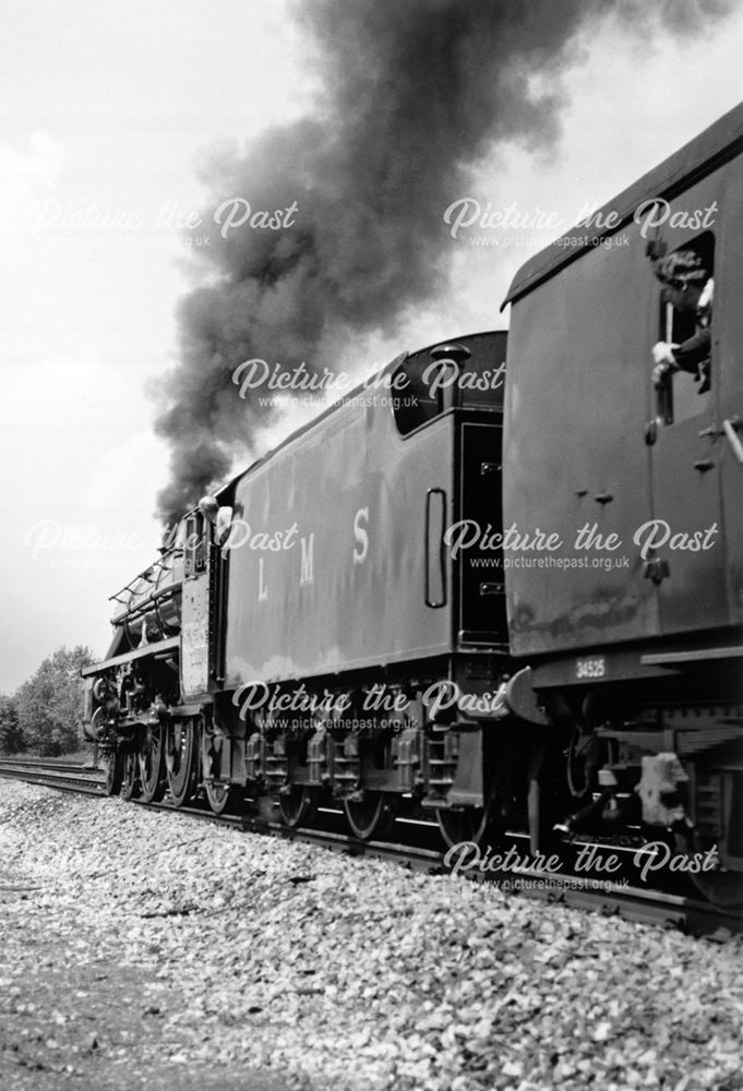 Preserved class 5 locomotive No. 5305 Alderman A.E. Draper leaving Derby Midland 