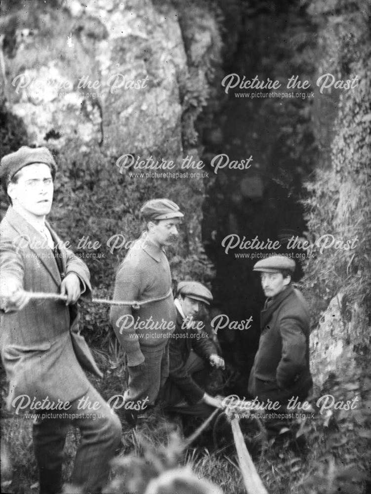 Cavers with ropes above cave entrance, Eldon Hole, near Sparrowpit/Peak Forest, c 1910