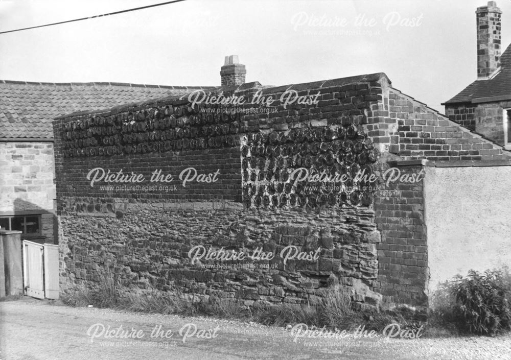 Wall displaying crucible pots built into the structure at the rear of no 2 Stead Street, Eckington