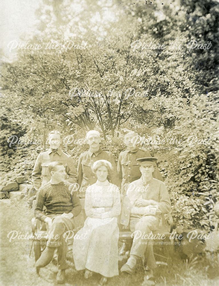 Recovering soldiers with nurse in the grounds