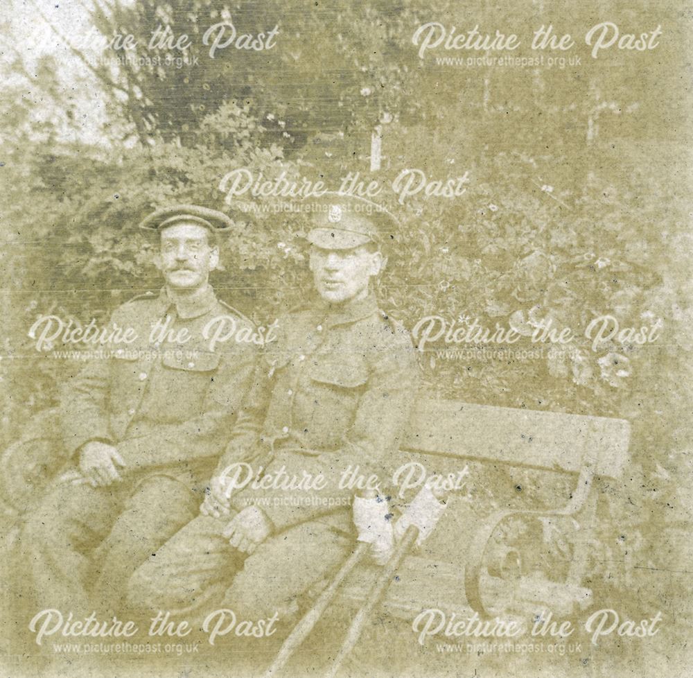 Two recovering soldiers sitting in the grounds