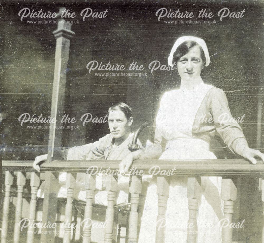 Nurse and patient on balcony