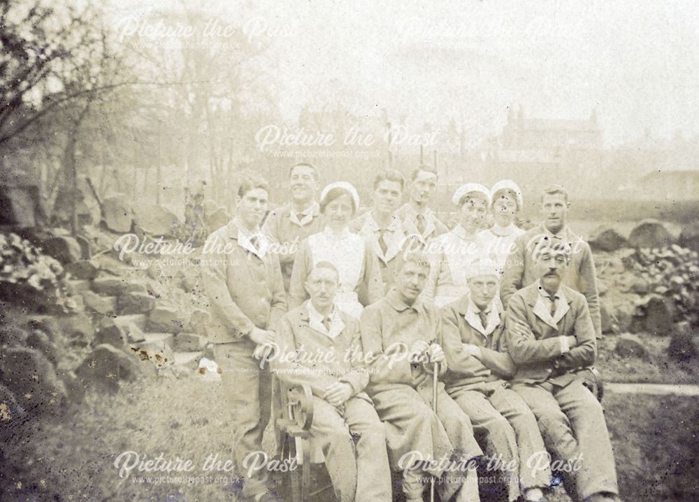 Recovering soldiers with nurse in the grounds