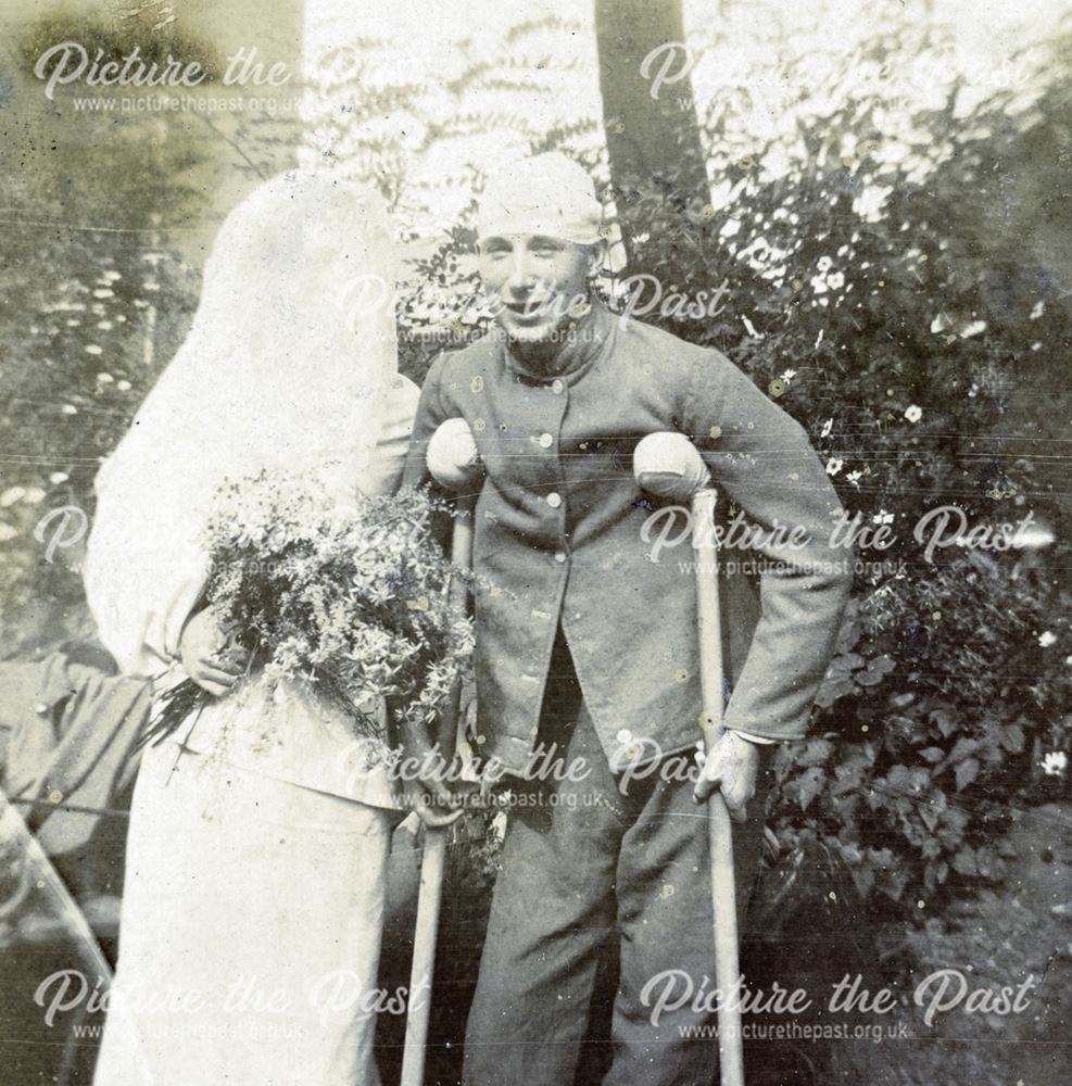 Soldier on crutches with bride