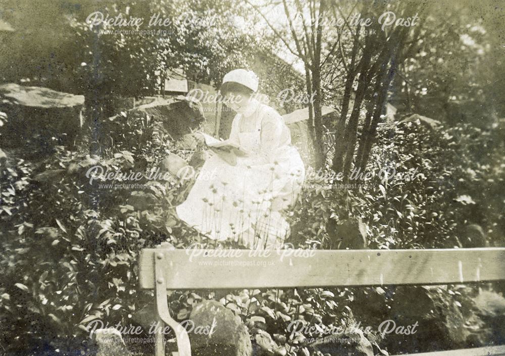 Nurse relaxing in the grounds