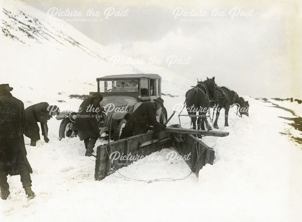 Snowplough and stranded car, Buxton, 1924