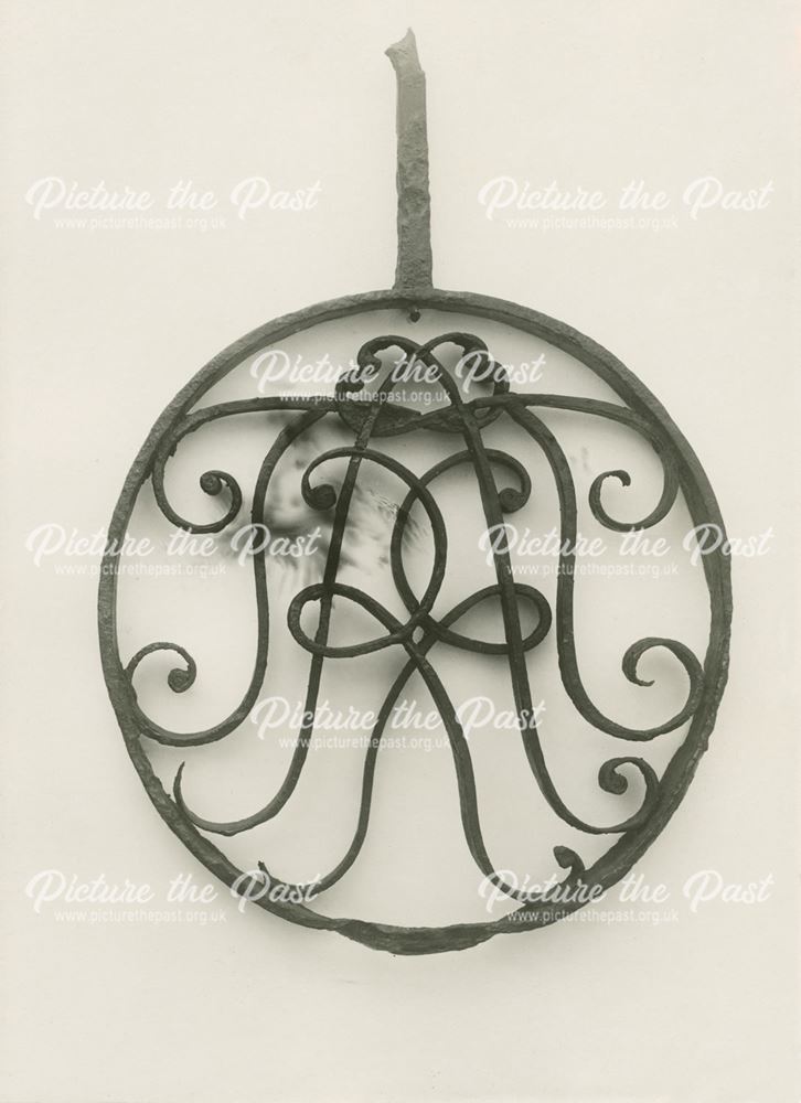 Wrought iron monogram of Thomas Rivett