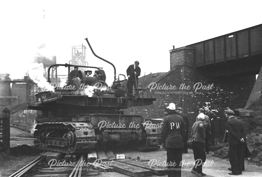 Unloading an excavator from a railway engine at Stanton Old Works