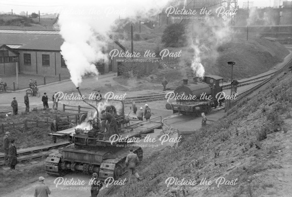 Unloading an excavator from a railway engine at Stanton Old Works