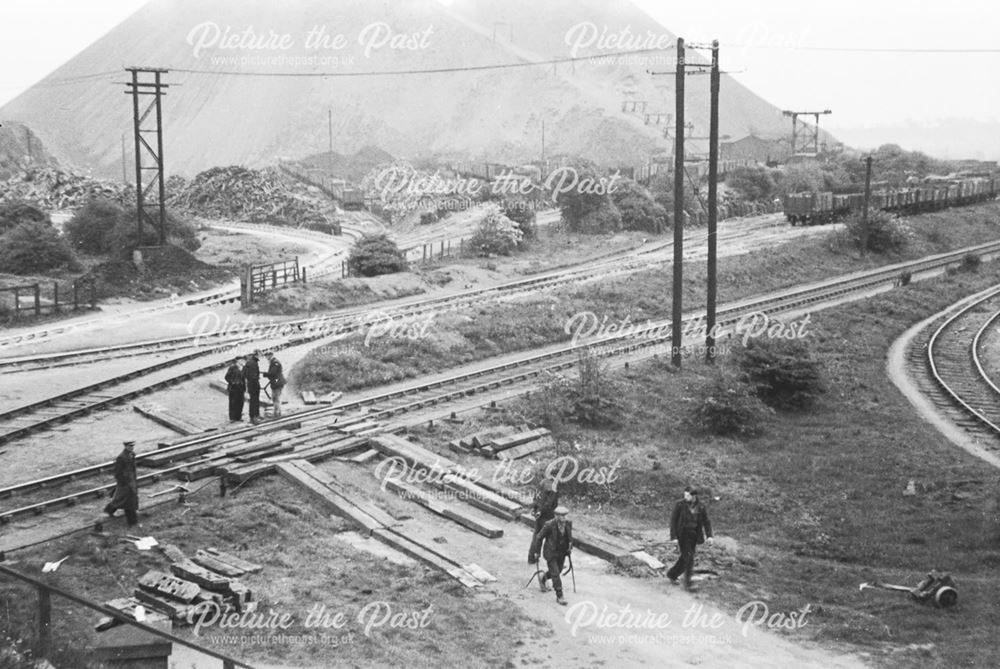 Unloading an excavator from a railway engine at Stanton Old Works